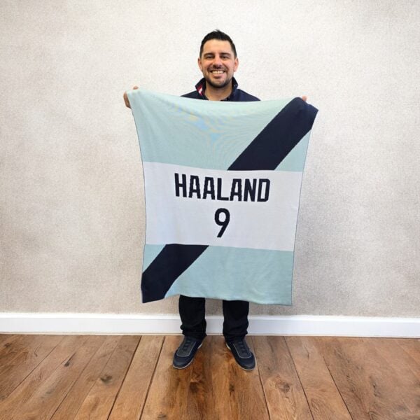 a man holding Custom Diagonal Band Jersey Blanket